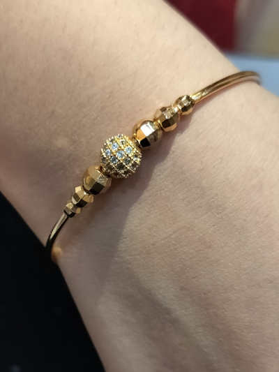 Simple Bangle Bracelet Surrounded By Textured Beads